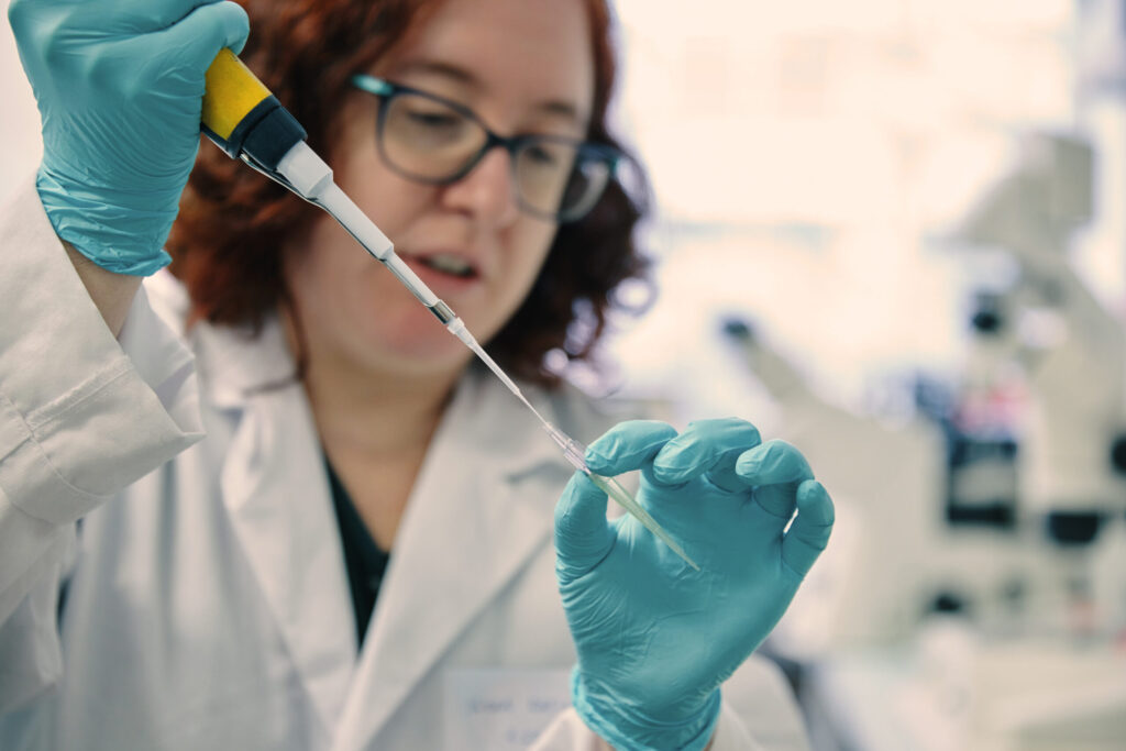 Scientist preparing a sample in laboratory setting